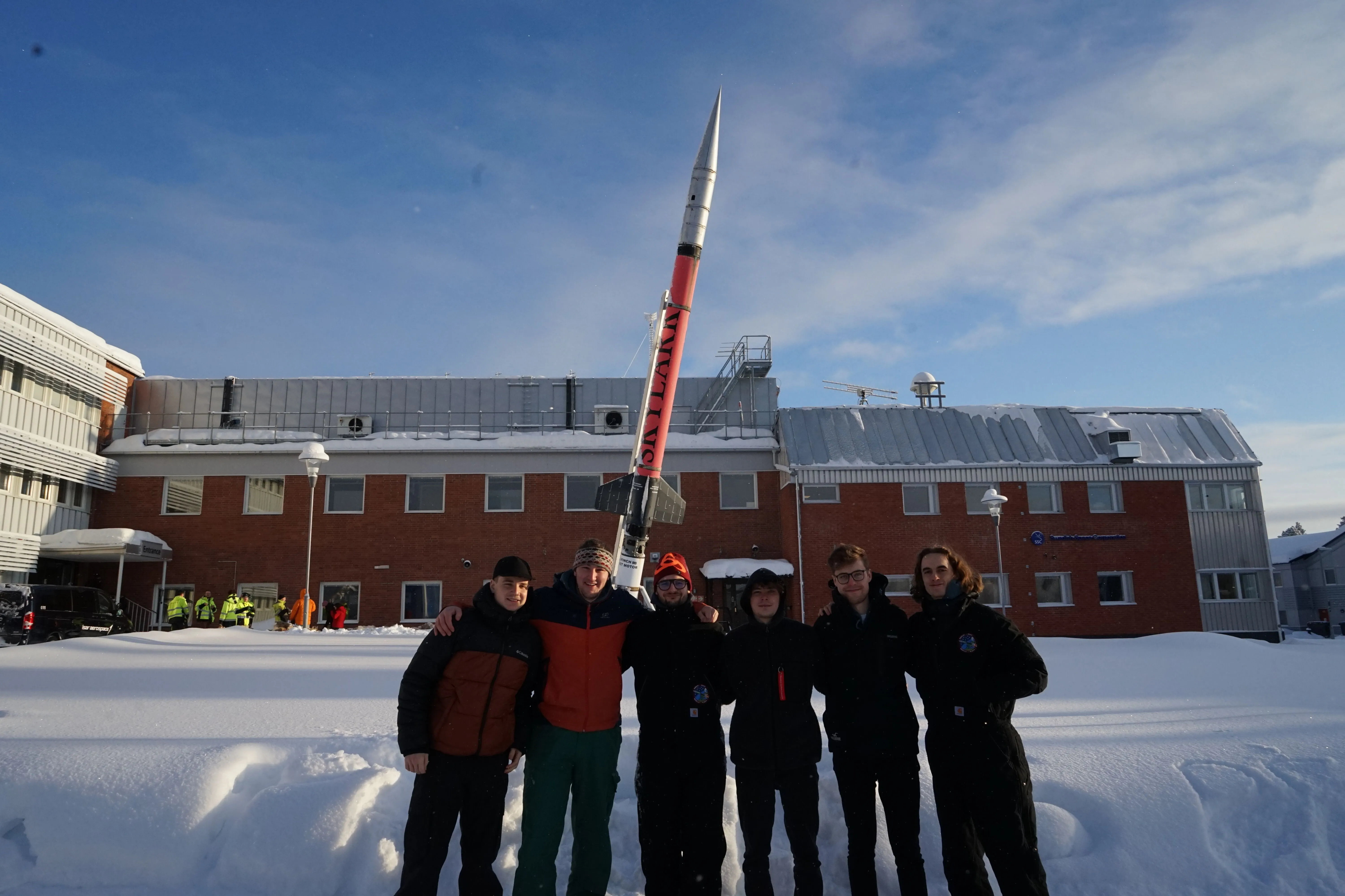 BEARS team posing with a rocket
